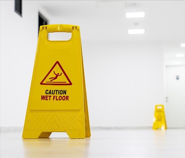 yellow wet floor caution triangle